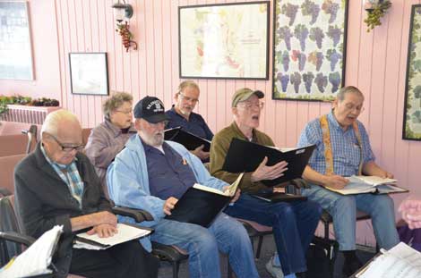 Patrick Lemon (third from left in front row), whose father was once a Memorie Singer, likes â€œthat we are bringing music to people who really enjoy hearing it.â€ Lemon is seen rehearsing with (front, from left) 96-year-old Bill Parks, Cliff Chapman and Rudy Horst, and (second row, from left) Phyllis Horst and Tony Baskett. (Joan Cronk/Senior Scene) 