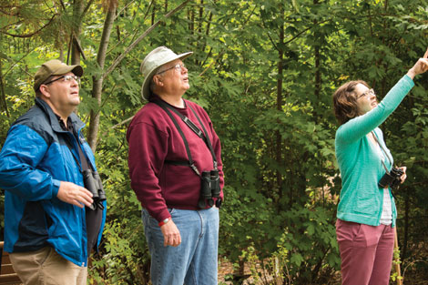 Russ Smith (middle) is a volunteer guide for birdwatching walks sponsored by Tahoma Audubon. (Emily Matthiessen/courtesy photo) 
